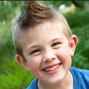 2015 kids cool hairstyles with spiky hair on the top and short hair on the sides.JPG
