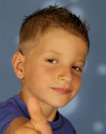 Very short little boy haircut with short spiky hair on the top and short hair on the sides.JPG
