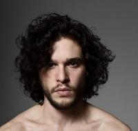 Sexy British actor Kit Harington with his curly haircut with curly side bangs.JPG
