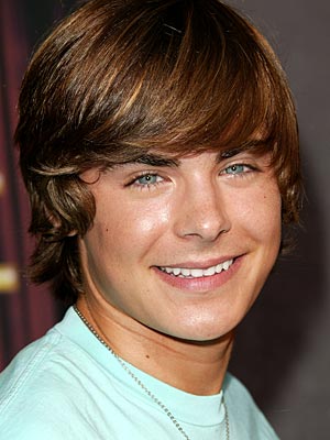 zac efron hairstyle. Zac Efron with medium curly