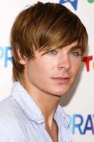 Zac Efron with short hairstyle with long bangs.jpg
