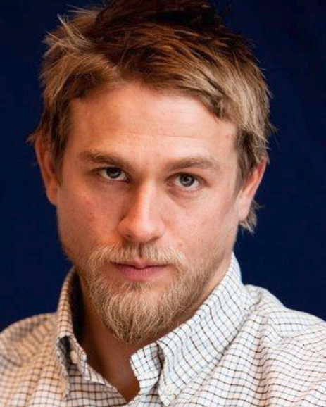 Charlie Hunnam with medium short hairstyle with layered bangs
