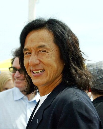 Jackie Chan with long haircut with long side bangs.jpg
