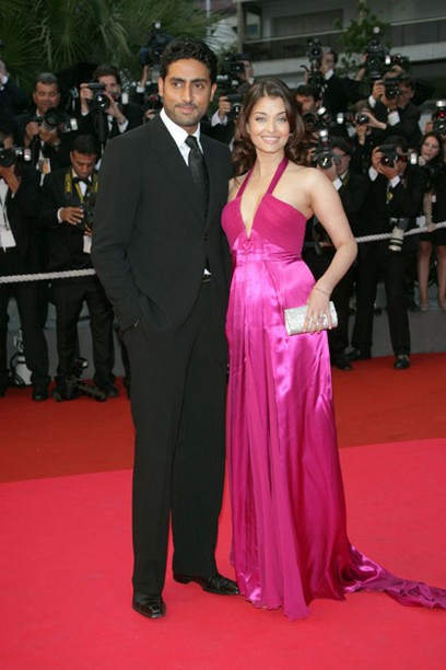 Abhishek Bachchan with his wife on red carpet.jpg
