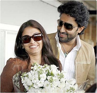 Abhishek Bachchan with medim curly and wavy hairstyle and the woman next to him is his wife, the most beautiful woman in the wor
