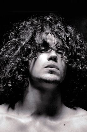 Man curly long hairstyle with very long curly bangs pictures.JPG
