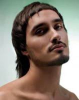 Men funky hairstyle with medium short bangs cross and medium long hair with layers in the back.PNG