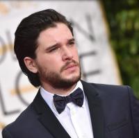 Kit Harington photos with his medium hairstyle long bangs pulled back.JPG