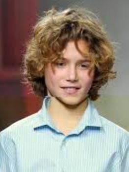 Boys long curly hairstyles with full curls and long curly bangs.JPG
