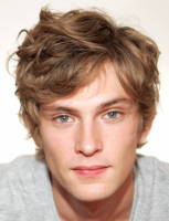 Short wavy men haircut with light curly bangs.PNG