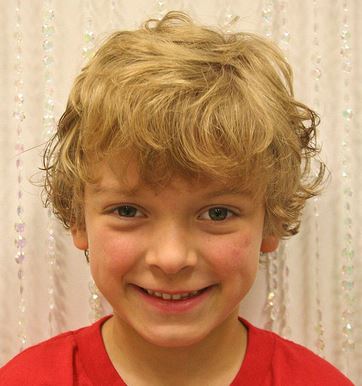 Wavy little boy haircuts photos with long wavy bang.JPG
