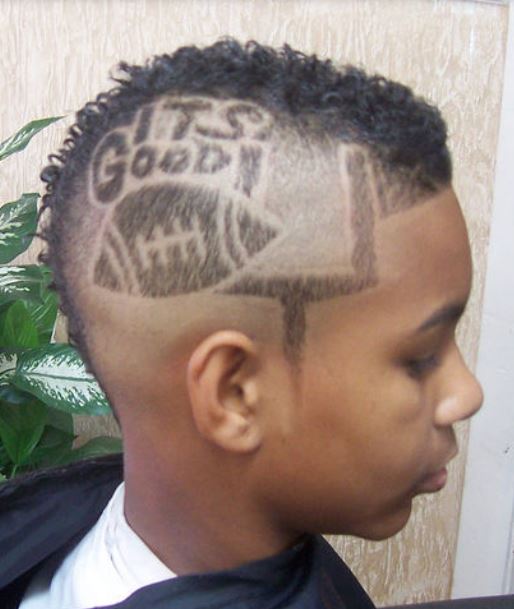Boys cool unique hairstyle with hair shaped bootball and words.JPG
