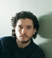 Kit Harington post picture with his medium waves and wavy side bangs.JPG