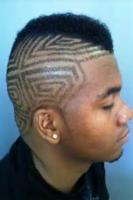 Black  boy cool hairstyle with mohawk haircut with awesome hair patterns on the sides.JPG
