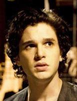 Kit Harington picture with his medium short curly hairstyle.JPG