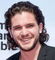 Kit Harington photo with his wavy haircut in medium hairstyle hair pulled back.JPG