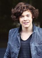 Harry Styles picture with his curly and layered hairstyle.JPG