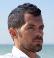 Mens newest undercut hairstyle with wavy hair top and very short hair on the sides