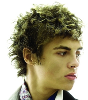 Curly teen boys hairstyles picture with medium long in the back and wavy in the front.PNG