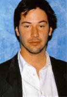 Keanu Reeves with Medium Layered Hair Style