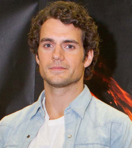 Henry Cavills with medium haircut with full curls.PNG

