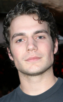 Young Henry Cavill pictures with him with his curly short hair.PNG
