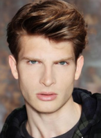 Classic wavy men haircuts in short hair length with long wavy long bangs.PNG