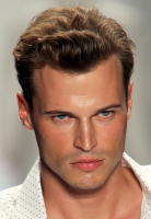 Wavy short men haircut with a cute curve in front on top.PNG