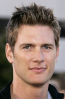 Mens layered short hairstyle with spiky bangs with a very short hair length.PNG