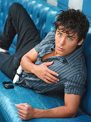 Zac Efron with short layered hairstyle with long bangs.jpg