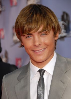 Zac Efron with hairstyle in long layered bangs.jpg
