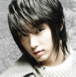 Medium layered hairstyle with long bangs.jpg