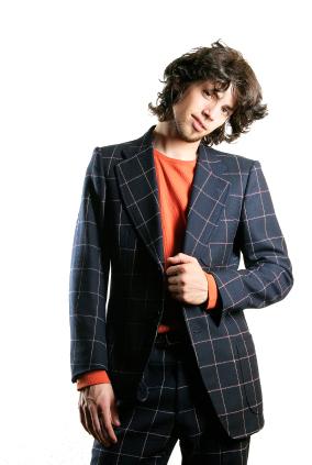 Men medium long curly hairstyle in brown hair.jpg