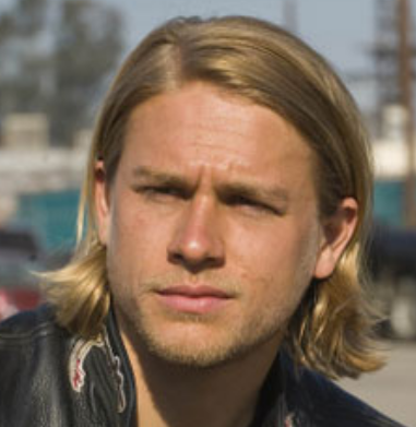 Charlie Hunnam rock n' roll hairstyle with long side bangs with spiky hair on at the tips
