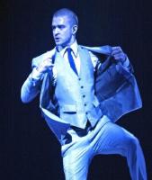 Justin Timberlake on stage in an elegant outfit.jpg