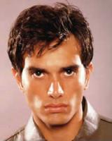 Men's Short Hair Style with wavies and long light curly bangs