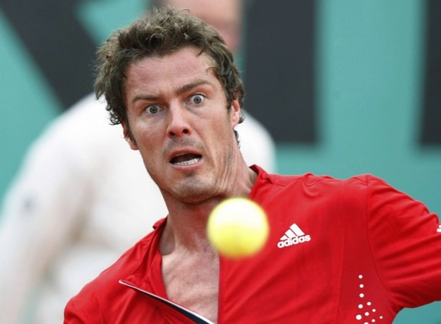 Russian tennis player Marat Safin eyes the tennis ball with a messy hairstyle at the French Open tennis tournament 2008.jpg
