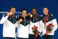 Michael Phelps, Garrett Weber-Gale, Cullen Jones and Jason Lezak with hair short haircuts holding the gold medal in Bejiing 2008
