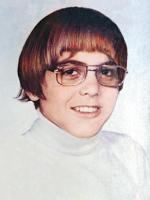 young George Clooney with a cool geek hairstyle.jpg