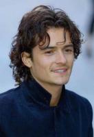 Orlando Bloom with long wavy hairstyle with curly bang.jpg