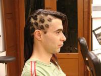 unique men hairstyle with half side super short with patterns and the other very long hair.jpg