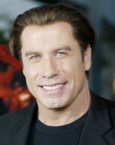 John Travolta short hairstyle with long bangs in the back.jpg