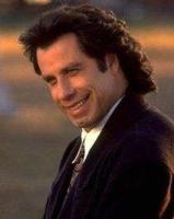 John Travolta with curly medium long hairstyle.jpg