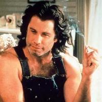 cute looking actor John Travolta with medium long curly and wavy hairstyle with long side bangs.jpg
