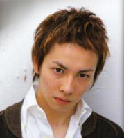 Hair style for teen man with short wavy hair in highlight with dark brown and light brown