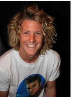 blonde medium curly men hairstyle.jpg