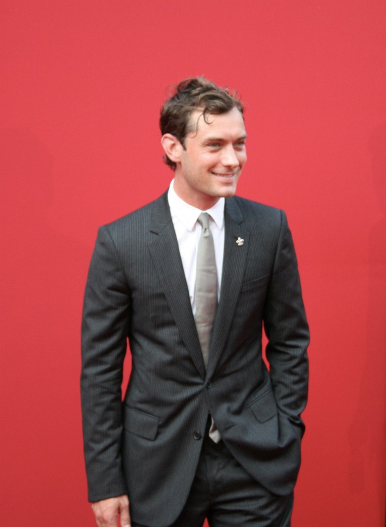 Jude Law on red carpet with his funky hair.jpg