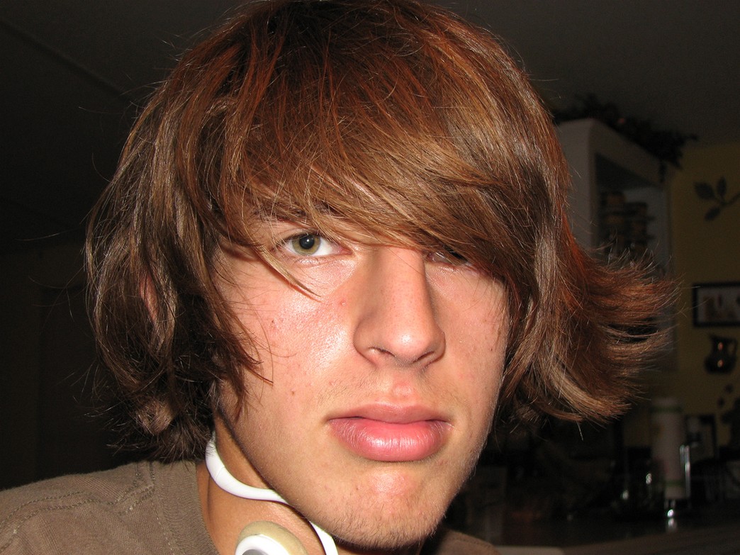 medium teen guy hairstyle with layers and swept bang.jpg