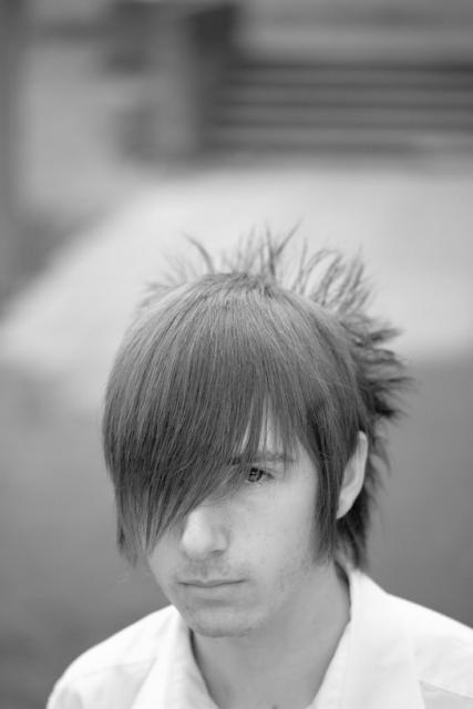 teen male short hairstyle with long bang and funky neck haircut.jpg
