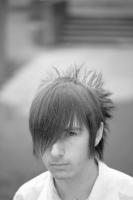 teen male short hairstyle with long bang and funky neck haircut.jpg